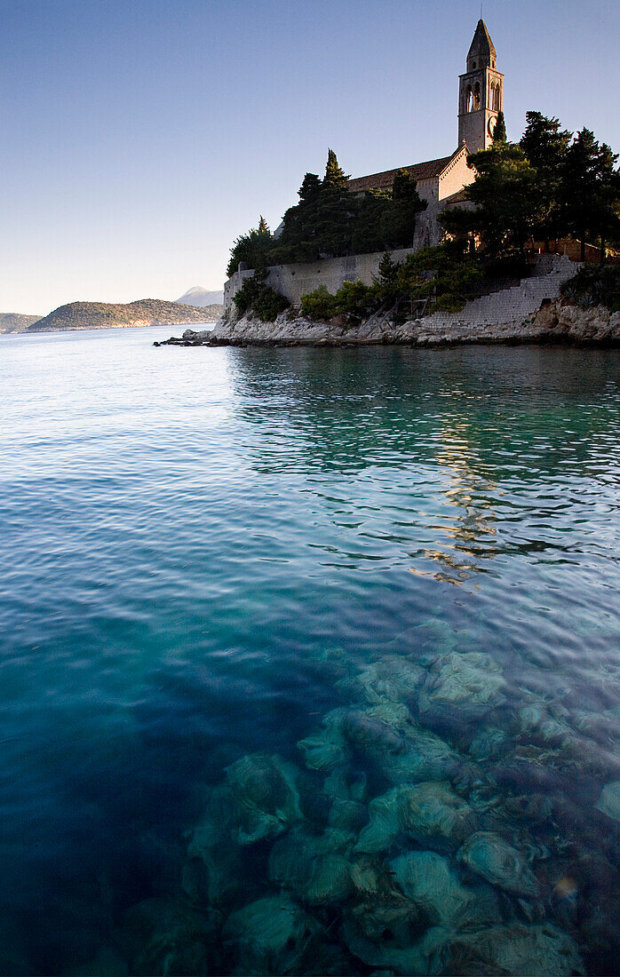 View across water at a monastery on the island of Lopud, Elafti Islands, Croatia.