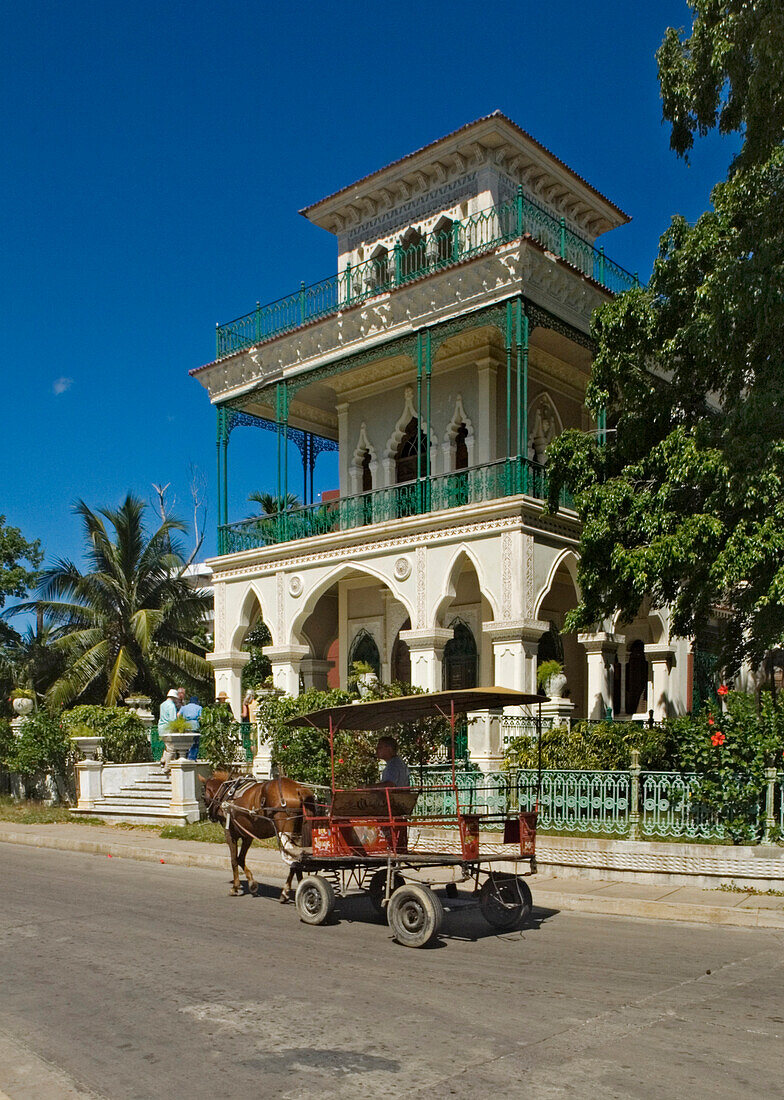 Horse cart in front of Palacio de Valle on Punta Gorda, Cienfuegos, Cuba