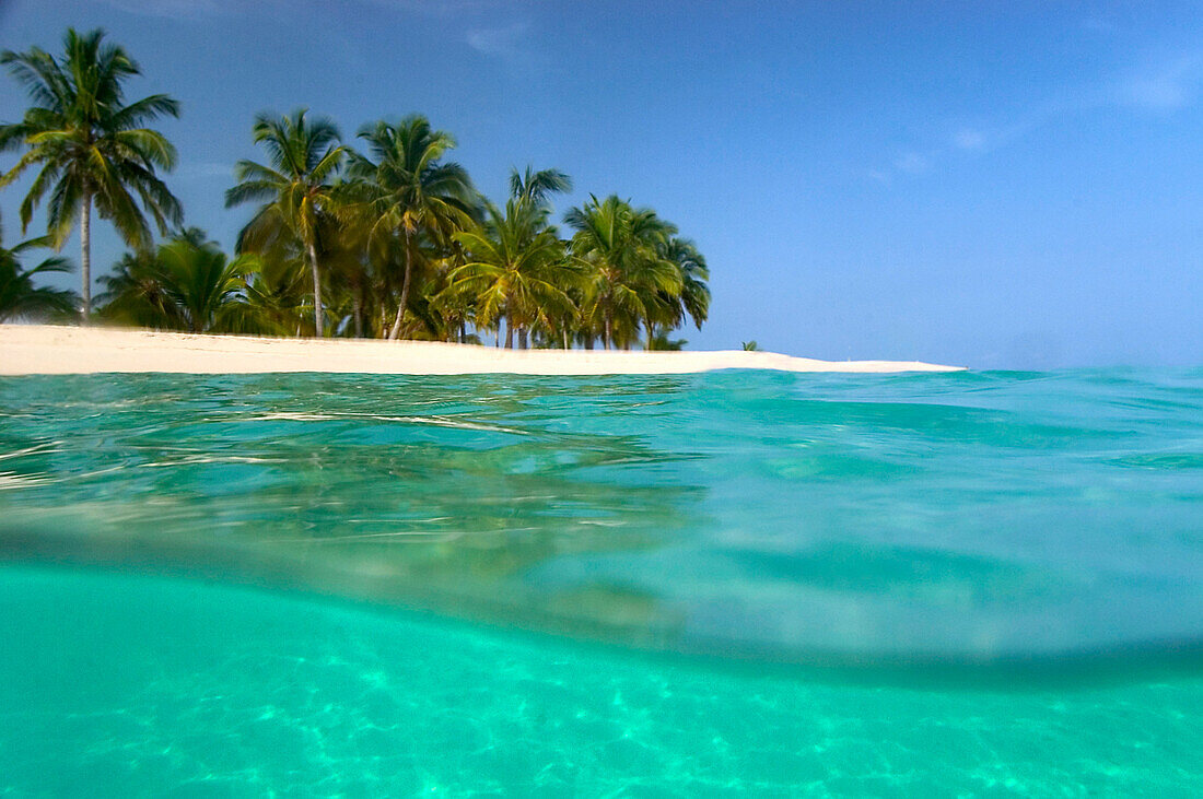 Looking ashore to Cayo Levantado as viewed half underwater, Cayo Levantado off Samana, Dominican Republic