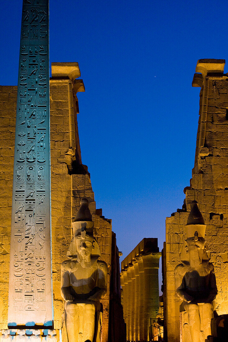 Large obelisk and colossi statues of Pharaohs, Luxor Temple, Luxor, Egypt