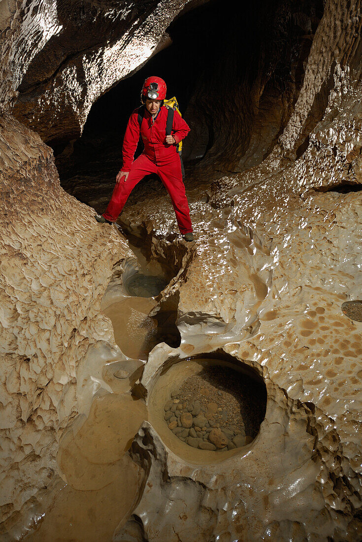 Speleology, caving, caver in gallery, Event de Peyrejal, Ardèche, France