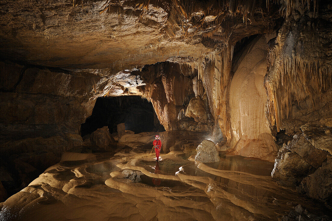 Speleology, caving, large gallery with rimstone pools full of water, Grotte de Gournier (Isere,  France)