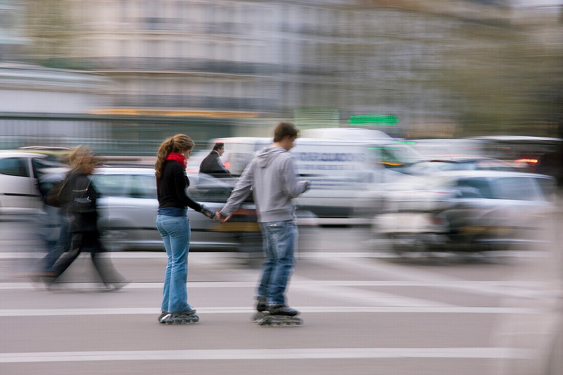 France, Paris, lovers practicing roller blade