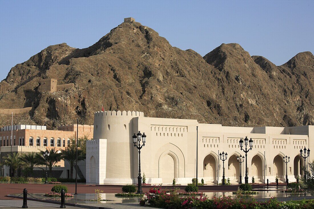 Oman, Muscat, government buildings colonnade, mountain scenery