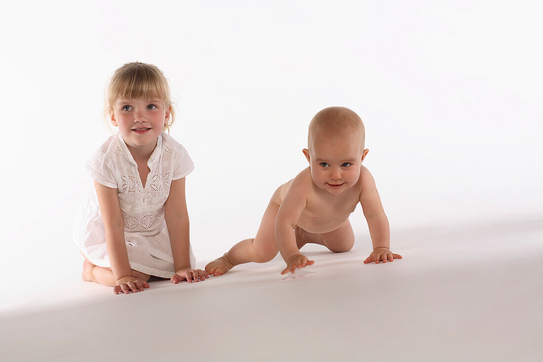 Girl and baby girl crawling