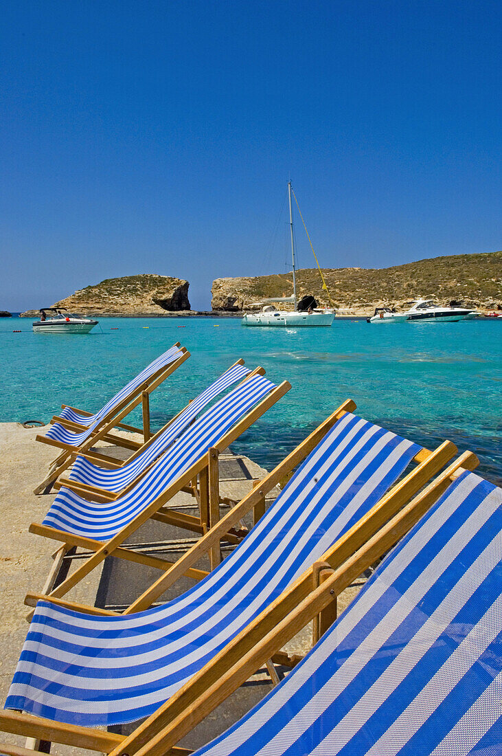 Empty deckchairs at Blue Lagoon, Comino Island, Malta
