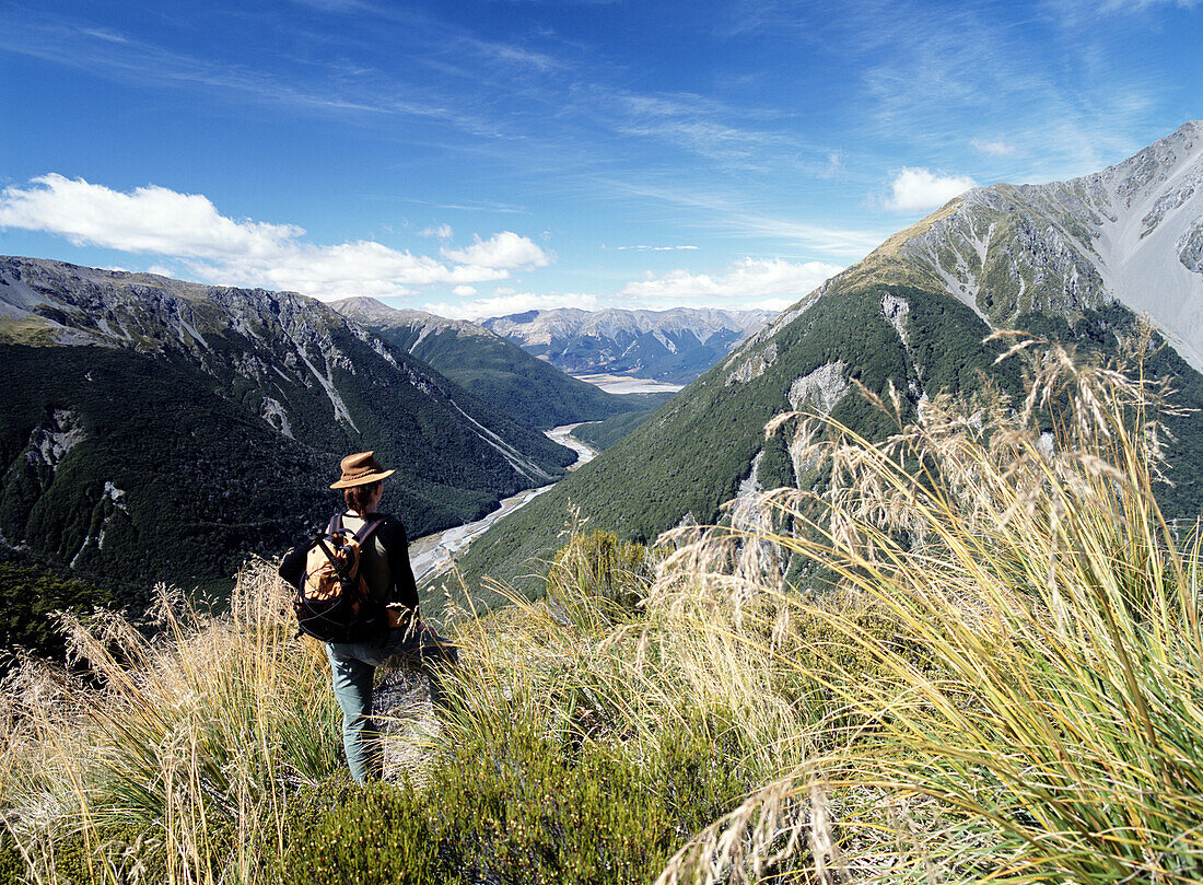 Woman admiring view down valley in Arthur's Pass National Park, Southern Alps, South Island, New Zealand