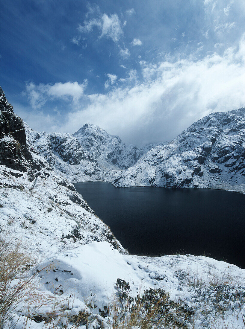 View across lake near top of Harris Pass on Routeburn Track, Mount Aspiring National Park, Southern Alps, South Island, New Zealand