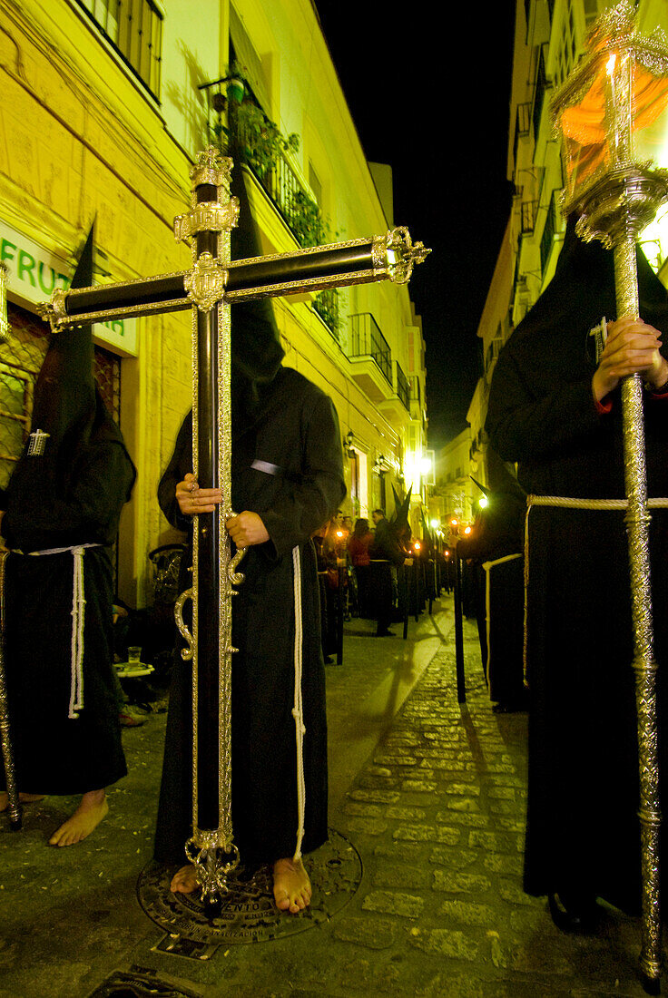Procession of masked hooded priests at Semana Santa Easter festival, Cadiz, Andalucia, Spain