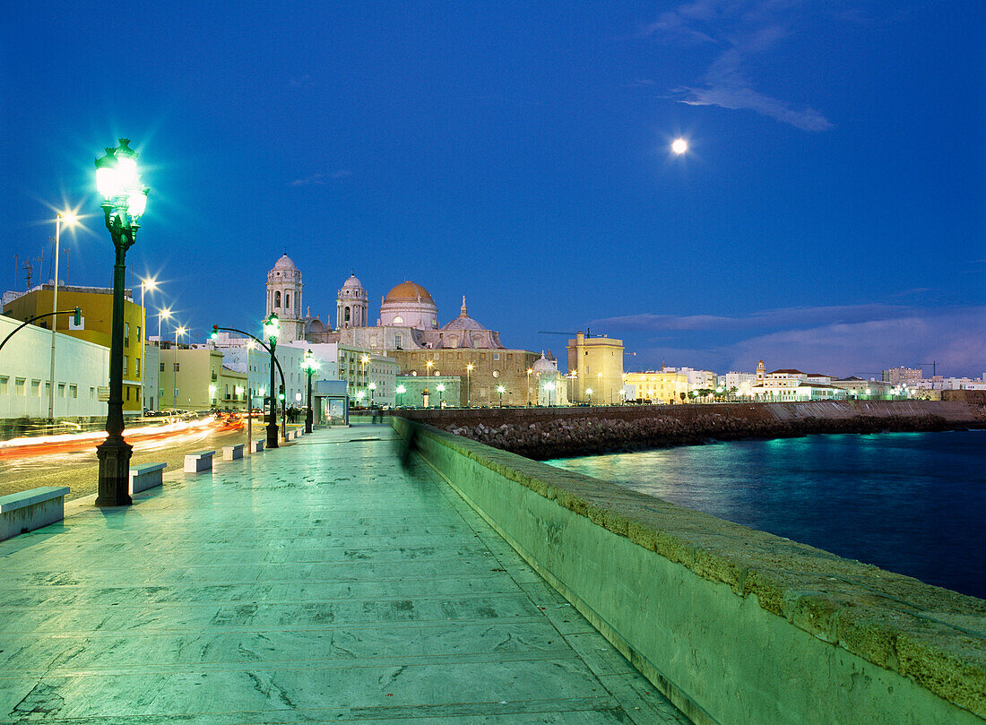 Seafront and cathedral of Santa Cruz at dusk, Cadiz, Andalucia, Spain