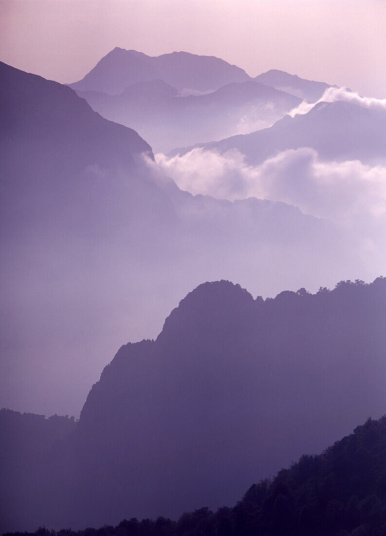 Looking across the mountains at dusk, Picos de Europa, Spain, Europe