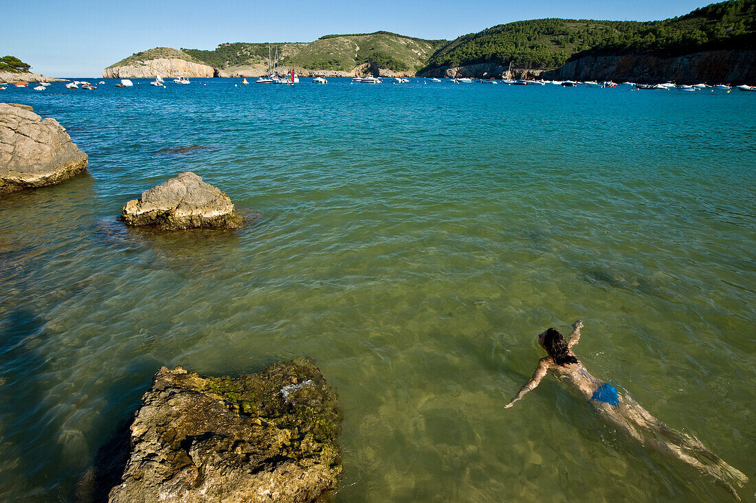 Girl swimming in sea at Cala Mongo, Costa Brava, Catalunya, Spain