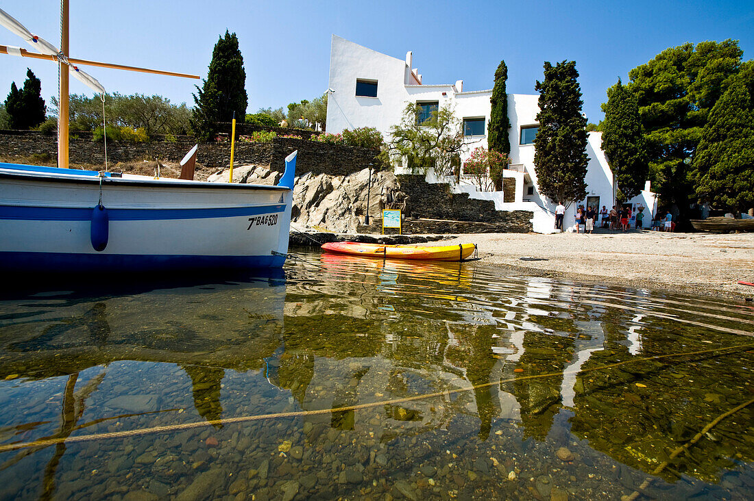 Boat moored on shore of Port Lligat, Costa Brava, Catalonia, Spain