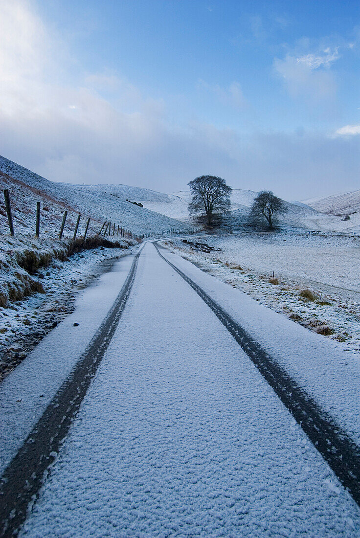 Car tracks in fresh snow, Perth and Kinross, Scotland, England