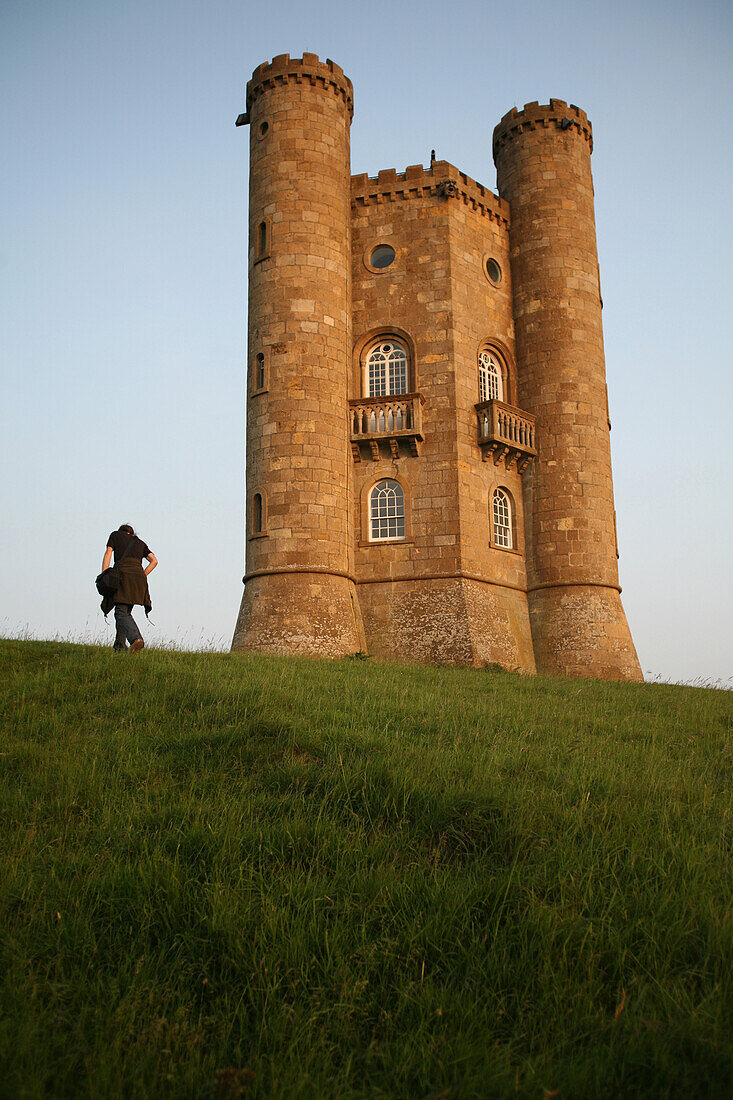 Tourist at Broadway Tower, second highest point in the Cotswolds, Worcestershire, England, UK