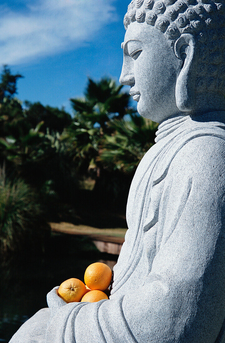 Stone buddha holding oranges, Indian Springs, California