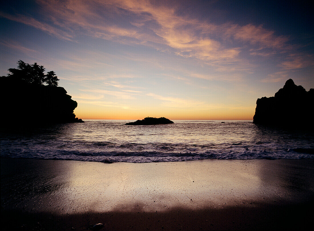 Looking out to sea at dusk from small beach in Julia Pfeiffer State Park, Big Sur, California