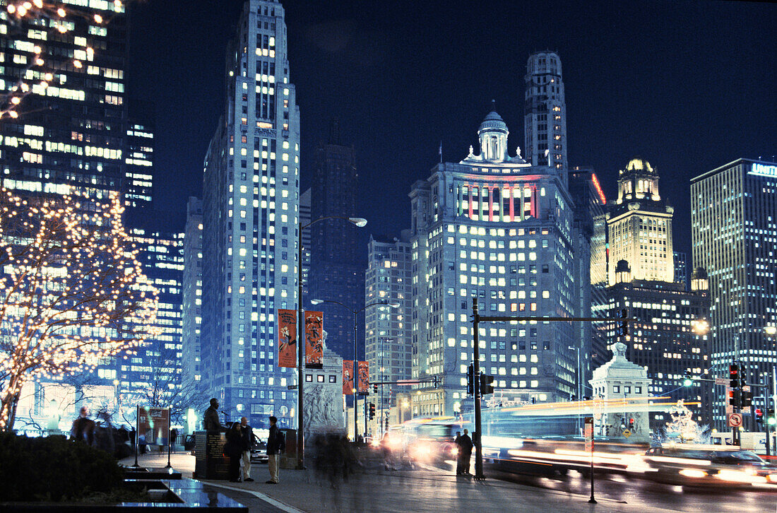 Michigan Avenue traffic at night with cityscape in background, Magnificent Mile, Chicago, Illinois, USA