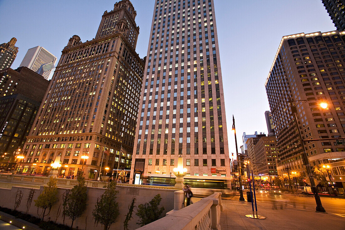 Pedestrian and street traffic at downtown intersection at dusk, Chicago, Illinois, USA