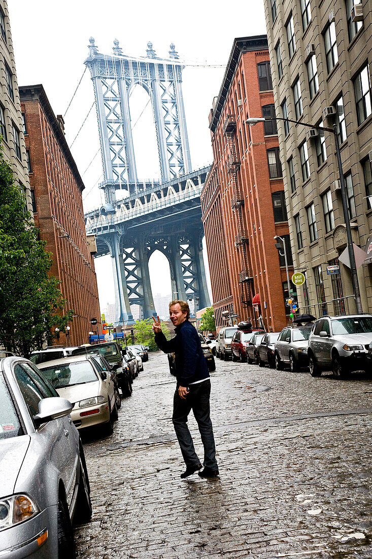 Young man near Brooklyn bridge, Dumbo, Brooklyn, New York City, USA