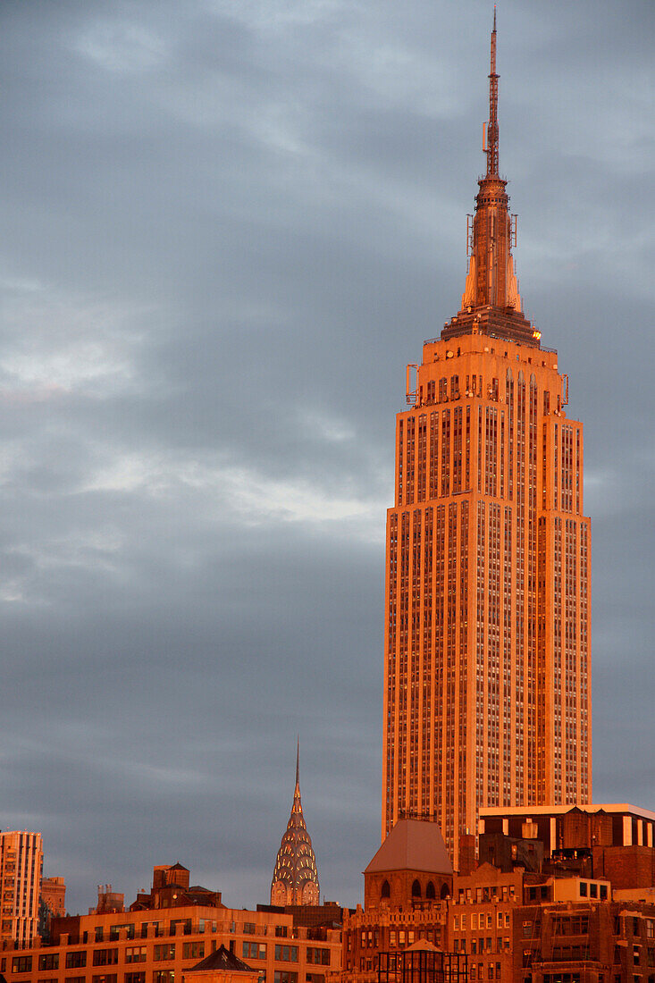The Empire State Building with Chrysler Building in background at sunset, New York City, USA