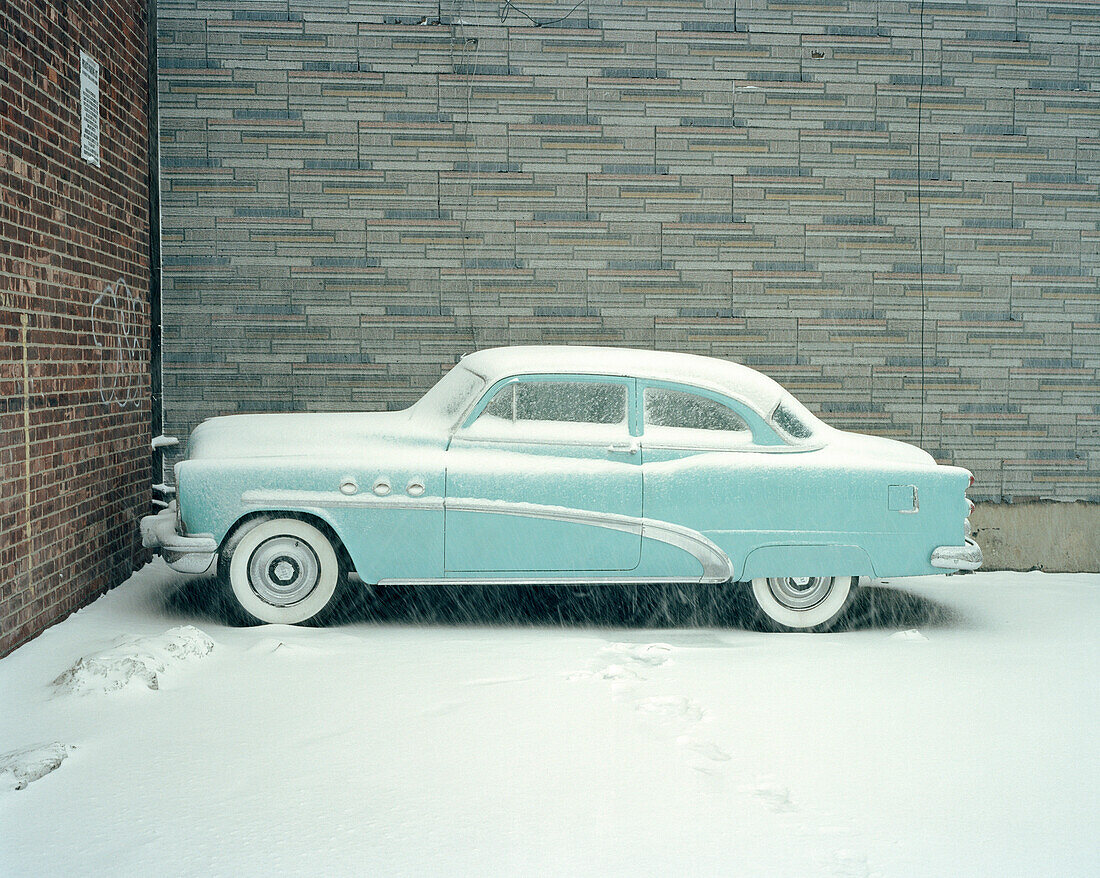 Blue Buick car in snow, Brooklyn, New York City, New York, USA