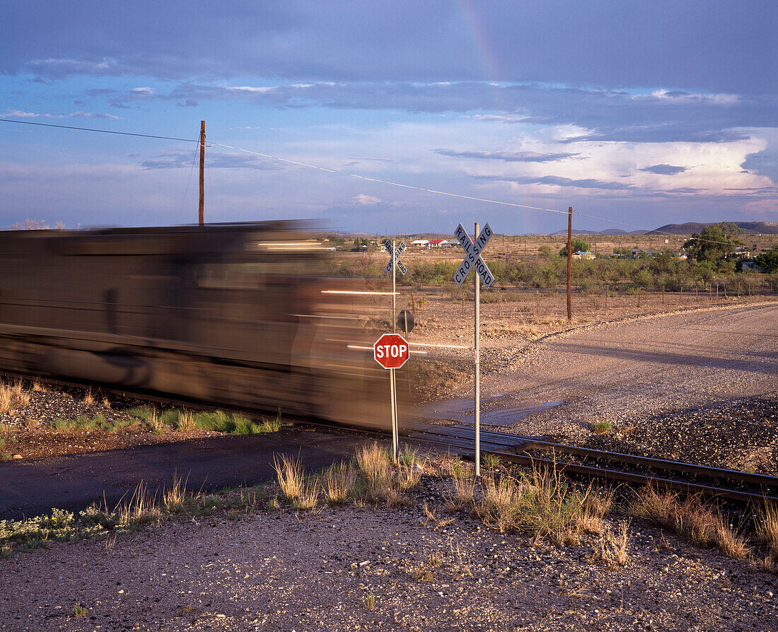 Blurred train on railroad crossing, Texas, USA