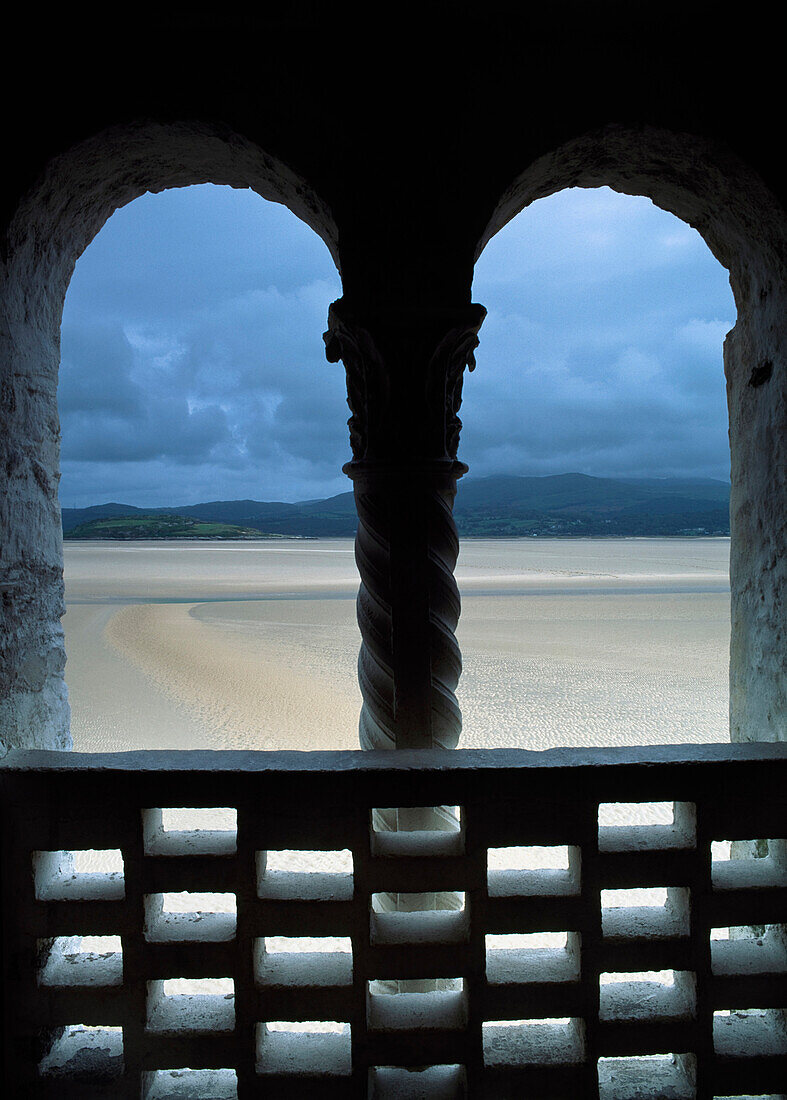 Arched window overlooking sea, Portmeirion, Gwynedd, Wales, UK