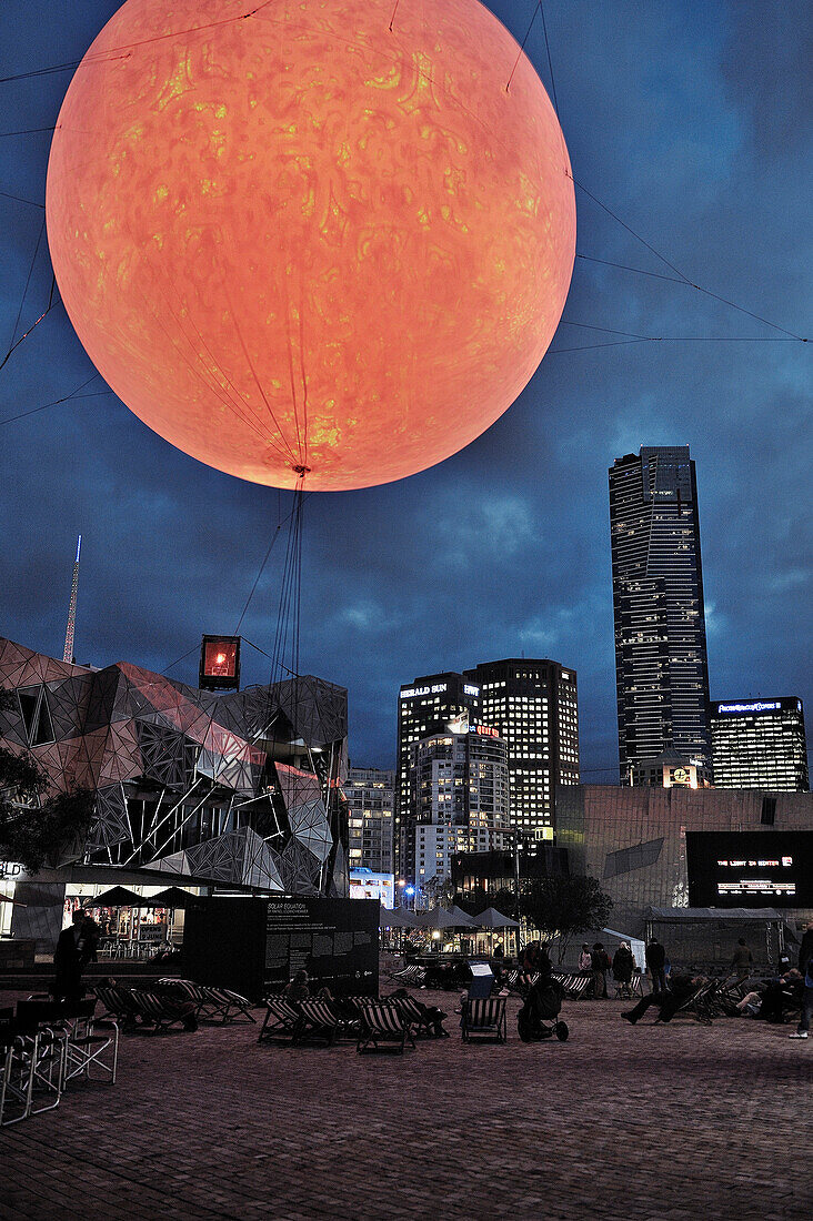 Light installation of sun at night, sculpture artwork, Melbourne, Vicoria, Australia
