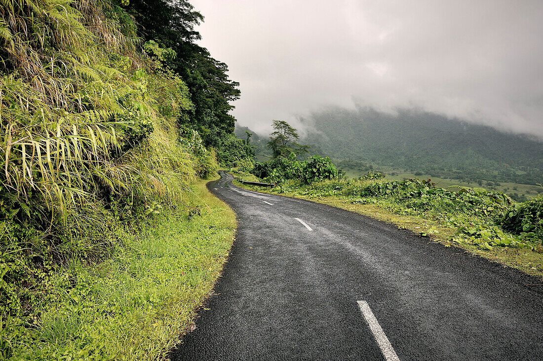 Road at interior of Upolu, mountains and clouds, Samoa, Southern Pacific
