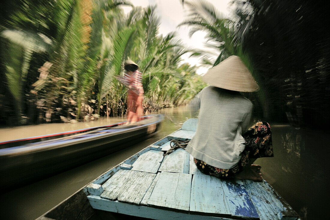 With a rowing boat along Mekong channel, Mekong Delta, Vietnam