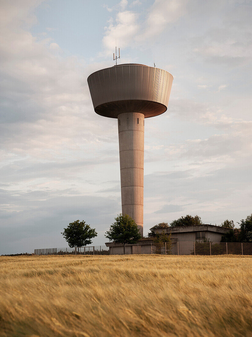 Water tower seen across a wheat field, Stadtwerke Aalen, Ostalbkreis, Baden-Wuerttemberg, Germany