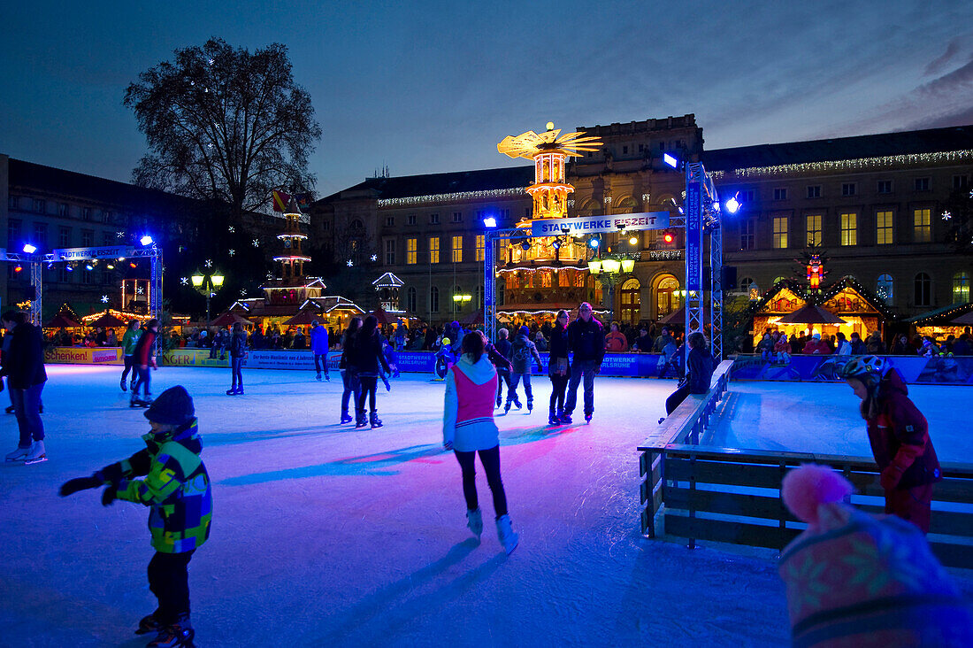 People ice skating at the Christmas market, Karlsruhe, Baden-Württemberg, Germany