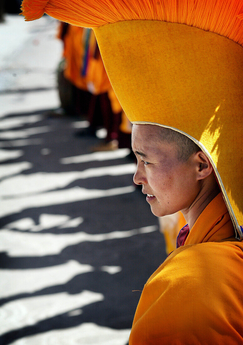 Nuns in traditional dress with yellow orange hats and robes at 800 year old birthday celebration / rituals of the Buddhist Drukpa Lineage, Naro Photang Shey, ( Shey Monastery ), Leh Ladakh, Indian Himalayas, India, Nuns in traditional dress with yellow or