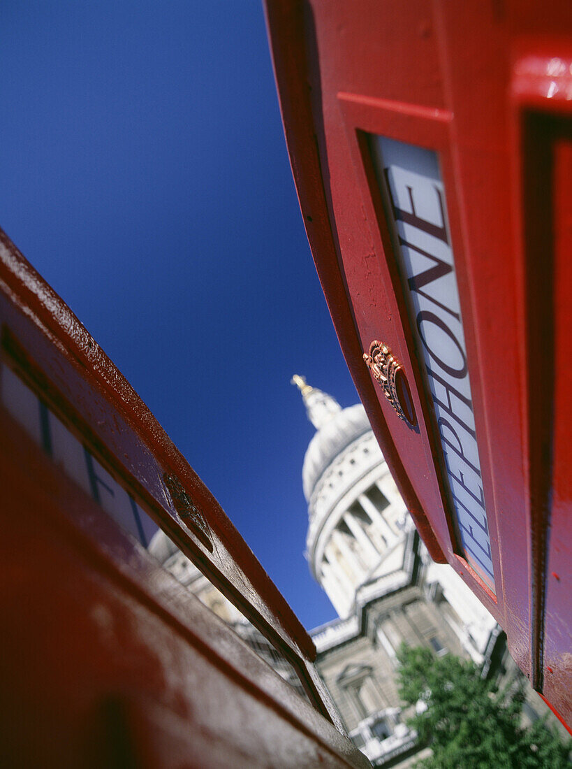 Looking between phone boxes to St Paul's Cathedral, London, England