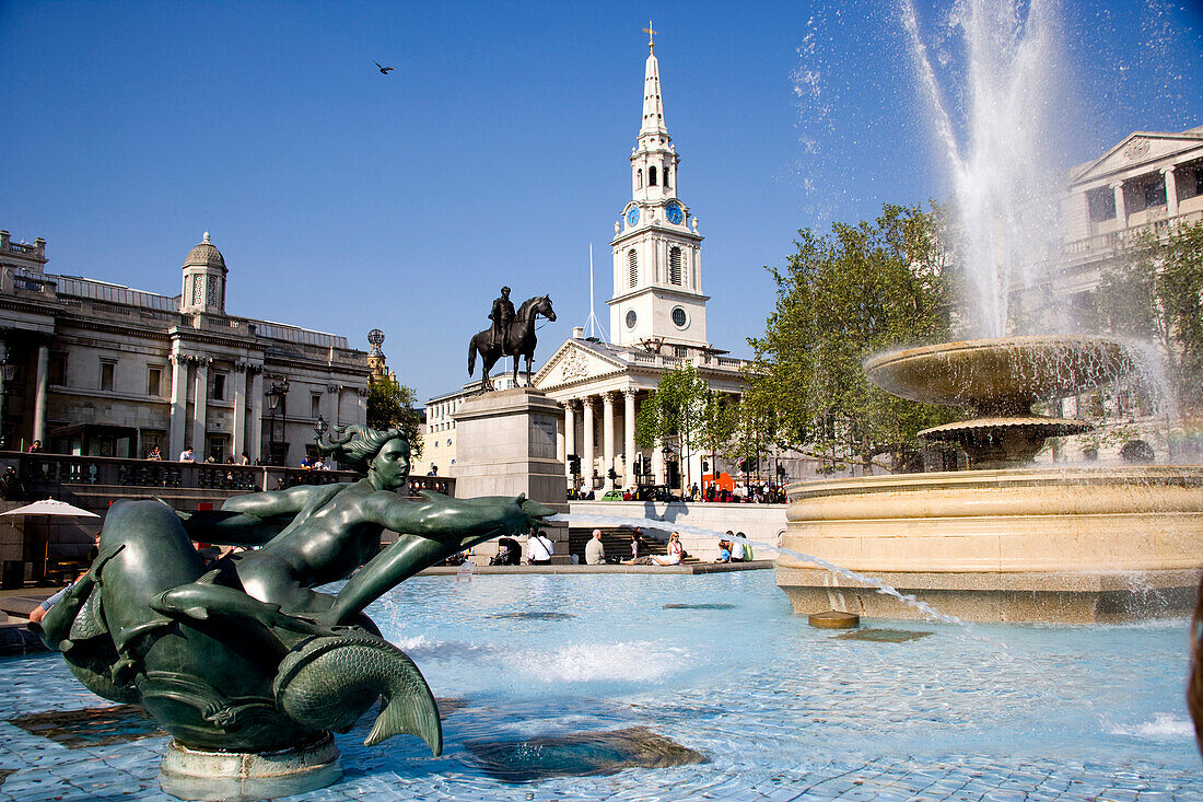 Low angle view of Trafalgar Square in London with fountains and statues, London, UK
