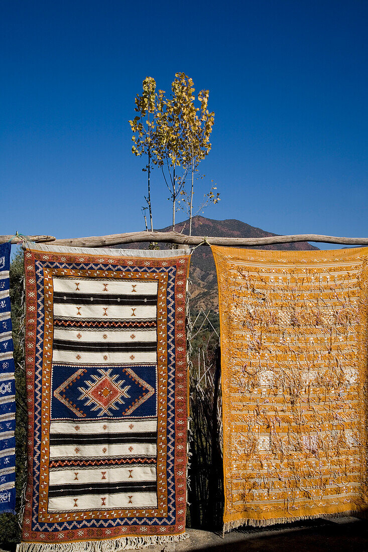 Carpets with mountains in background, Atlas Mountains, Morocco