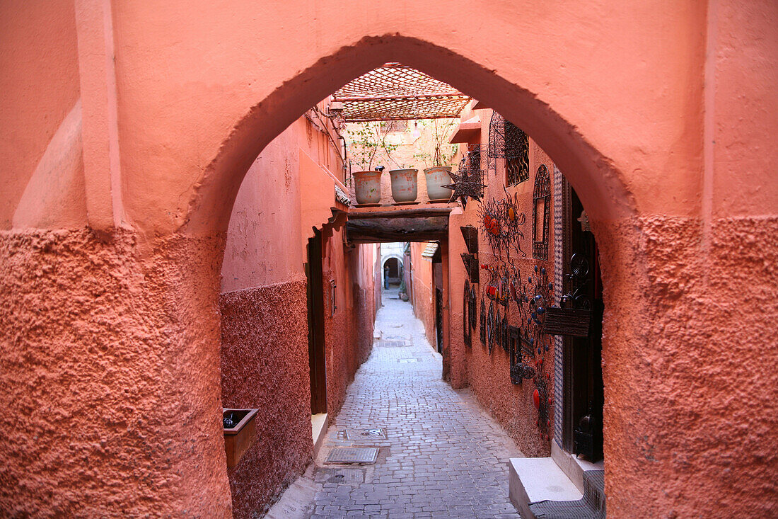 Looking down a colorful narrow alleyway / lane in the souk Marrakesh, Morocco, Marrakesh, Morocco