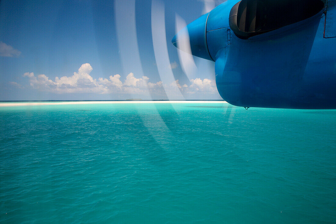 Airplane's  propeller over Soneva Fushi lagoon, Northern Atoll, Maldives