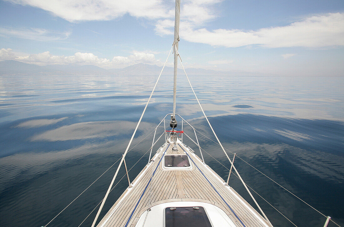 Bow of the yacht sailing through calm waters, Mediterranean sea