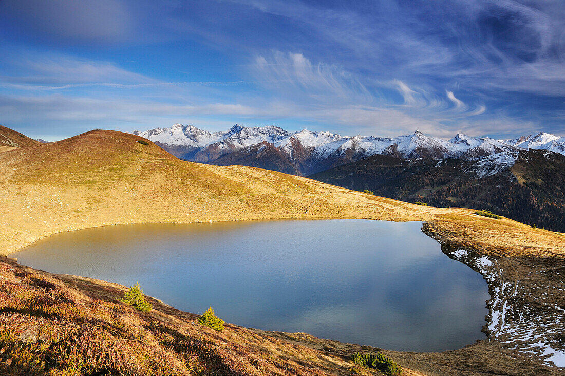 Mountain lake with Zillertal range in background, valley of Obernberg, Stubai range, Tyrol, Austria, Europe