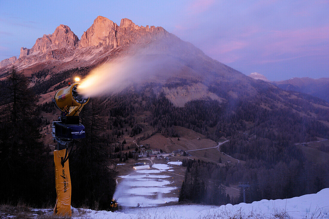 Snow cannons blowing artificial snow on slope, Rosengarten range in background, Latemar range, Dolomites, UNESCO World Heritage Site Dolomites, Trentino, Italy, Europe