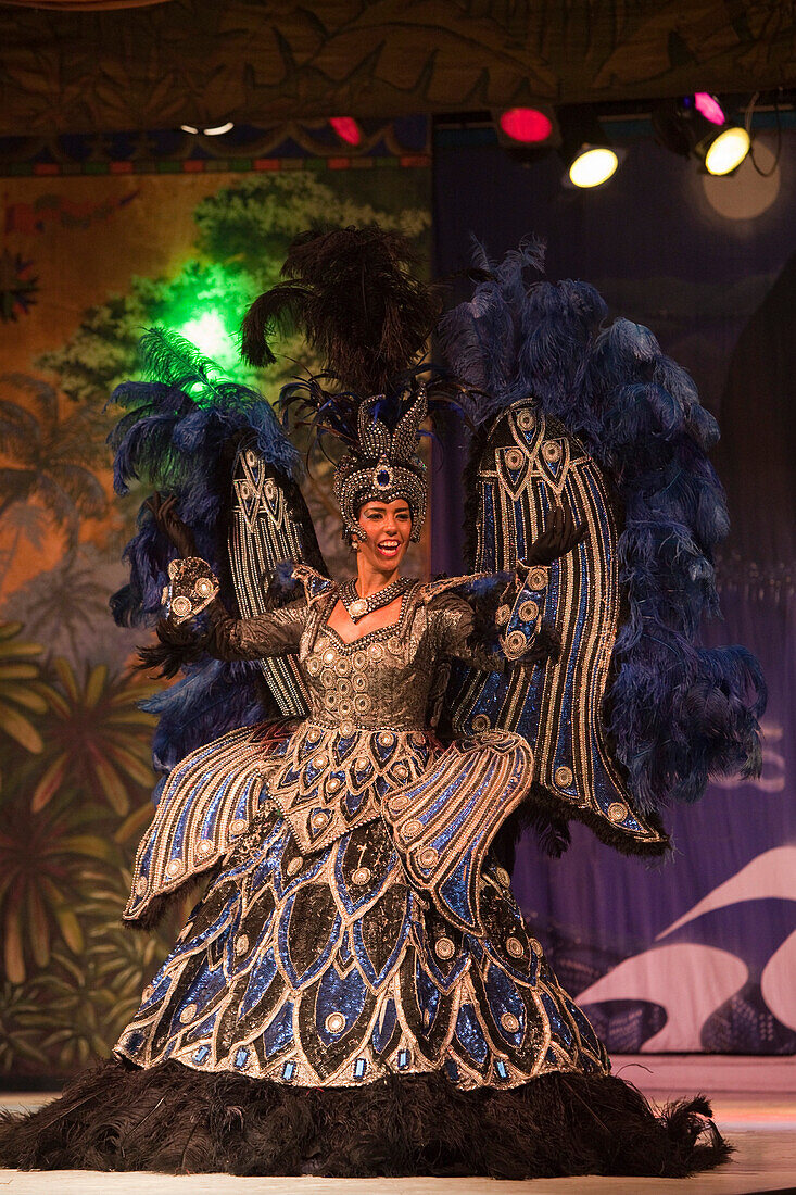 Woman wears colorful costume at folklore and samba dance show at Variete Plataforma 1, Rio de Janeiro, Rio de Janeiro, Brazil, South America