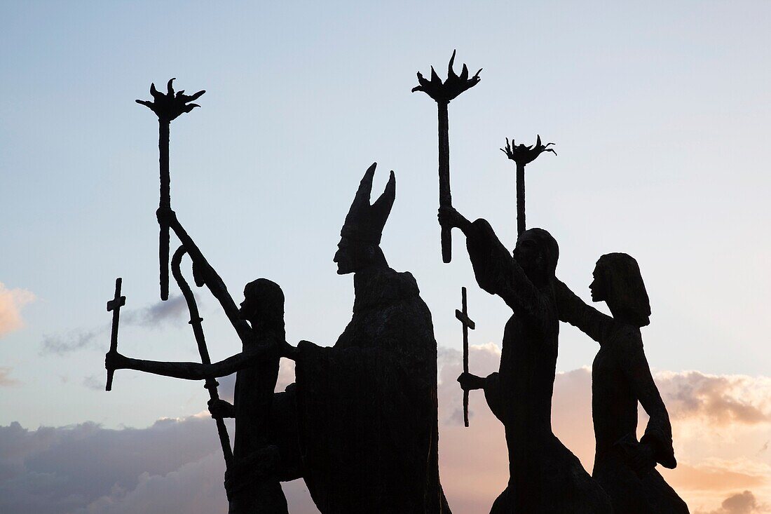 Puerto Rico, San Juan, Old San Juan, Plazuela de la Rogativa, sculpture of the bishop of San Juan and three women, sunset
