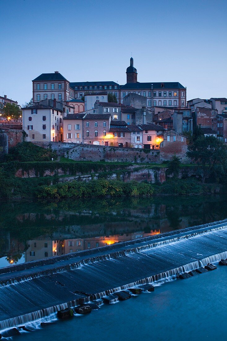 France, Midi-Pyrenees Region, Tarn Department, Albi, town overview by the Tarn River, dusk