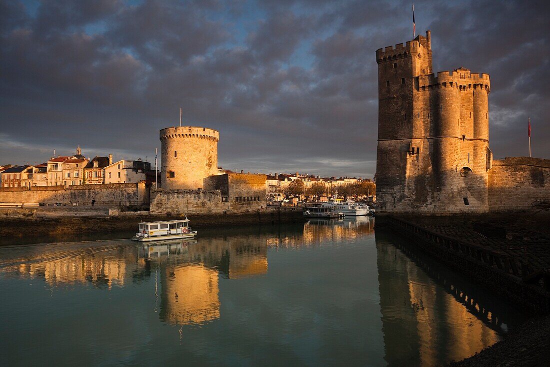 France, Poitou-Charentes Region, Charente-Maritime Department, La Rochelle, Old Port, Tour de la Chaine and Tour St-Nicholas towers, dawn