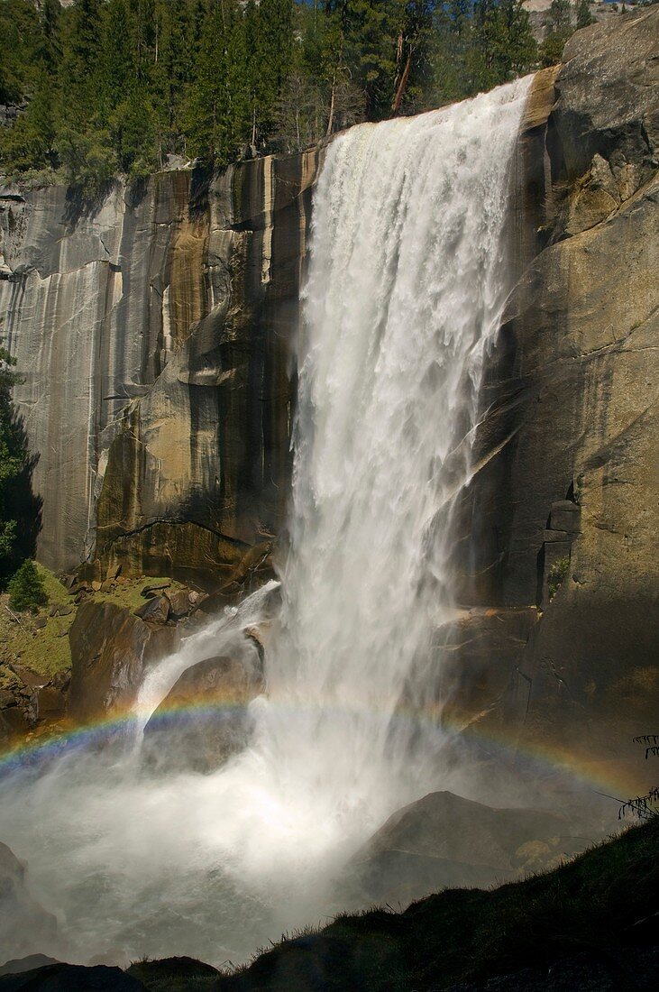Rainbow at the base of Vernal Fall waterfall, Yosemite National Park, California