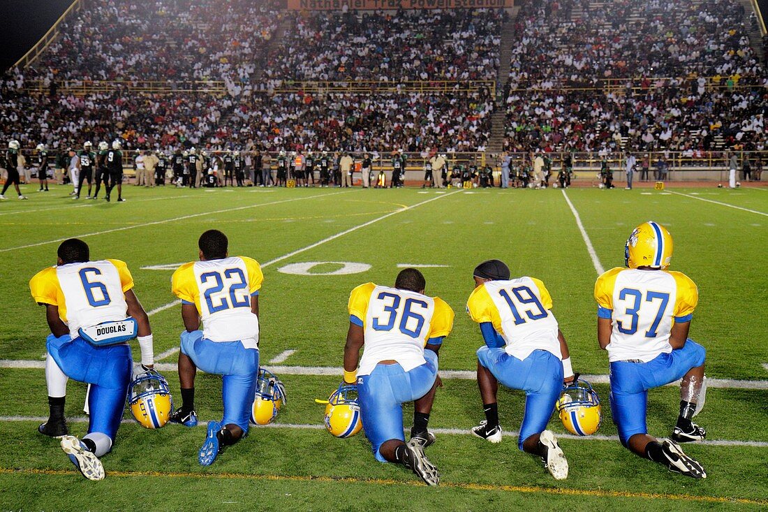 Florida, Miami, Miami Dade College North Campus, Traz Powell Stadium, high school football playoff game, Northwestern vs  Central, Black, players, student, teen, sideline, watching