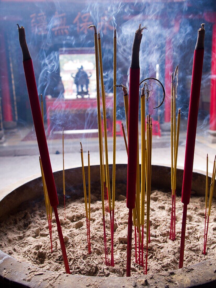 Incense burns in Buddhist temple in Ho Chi Minh City, Vietnam