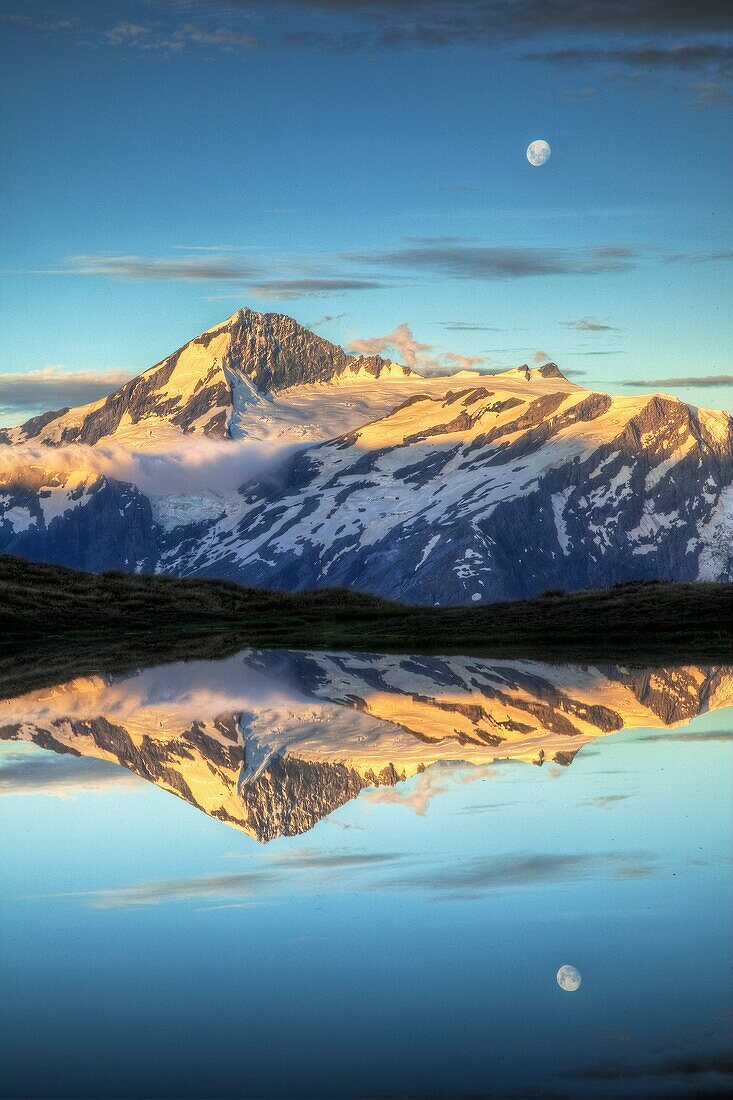 Mt Aspiring, moonrise over Cascade Saddle tarn, Mount Aspiring National Park, Otago, New Zealand